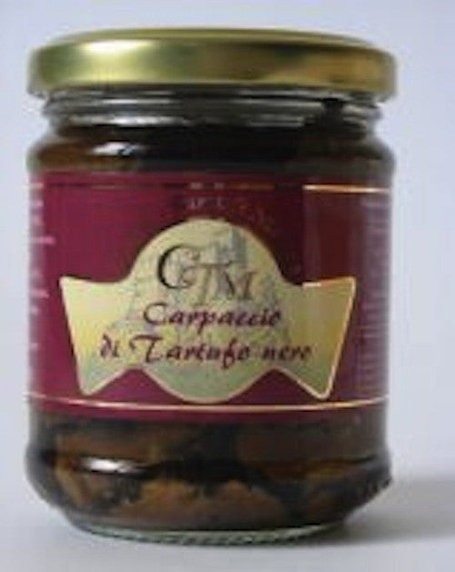 Sliced black summer truffle in extra-virgin olive oil